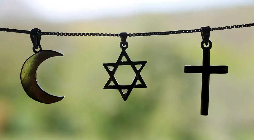 photo of the symbol of island, judaism, and christianity